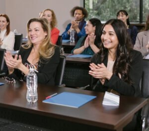 business executives applauding business meeting 1